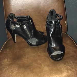 Black leather high heels with zippers